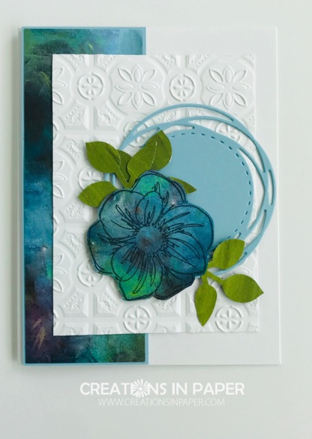 Stamping on designer series paper is a great way to get interesting images. The Floral Essence in blues and greens uses the watercolor pattern from the retired Perennial Essence designer series paper.