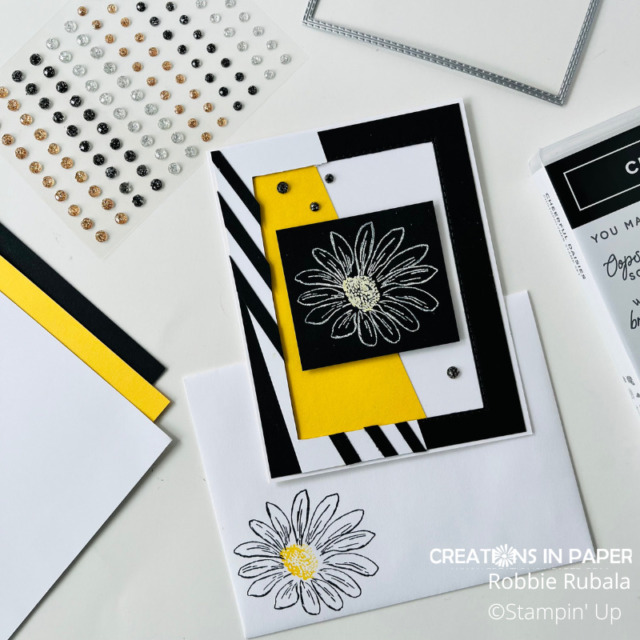 The outline of the daisy is a great image to heat emboss.  You can also color the center using your colored pencils to tie the colors together for this Black & White with a pop of color.