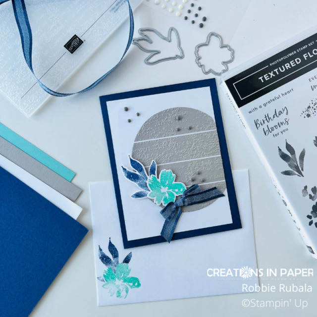 Using the flower element from the card front for the inside of the card and envelope carries the theme through all the pieces.  Find out more about the Stampin' Up Textured Floral color challenge card by clicking the photo.